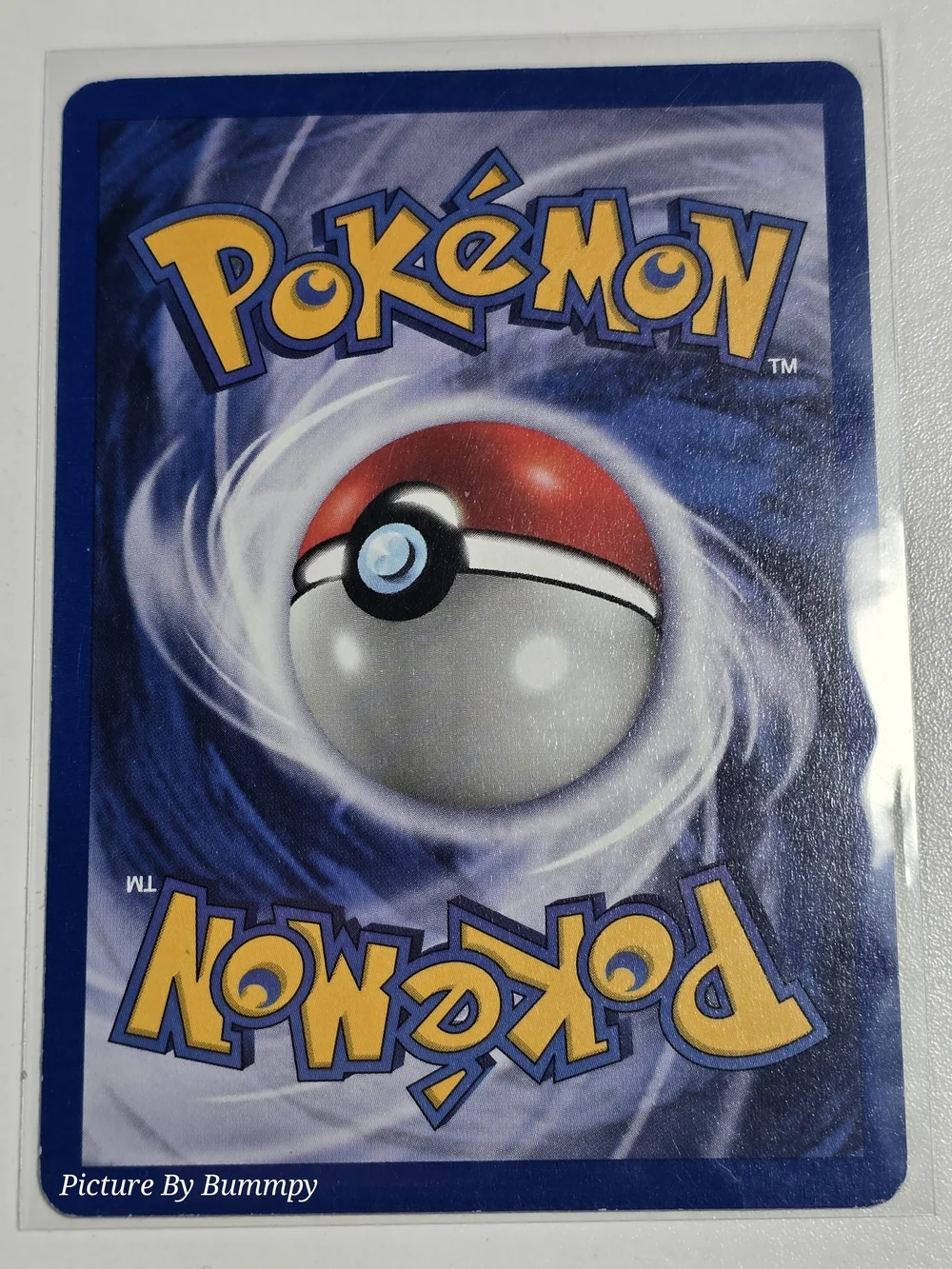 #13 Pokemon 1st Edition Ekans card from the 2000 Team Rocket expansion, #56/82.